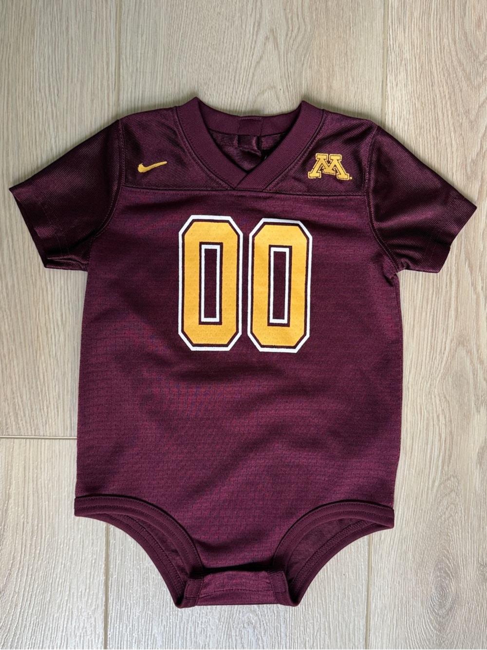 Nike Kids Maroon Bodysuit with Gold Detailing
